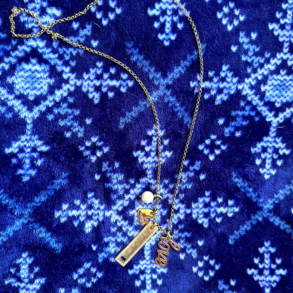 Love this long “LOVE” necklace. Super cute rose gold.